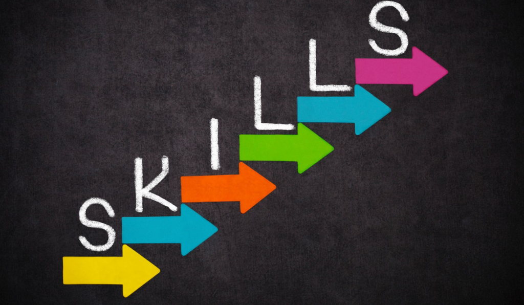 Colorful arrow steps with "SKILLS" written on each step, representing a step-by-step approach to upskilling.