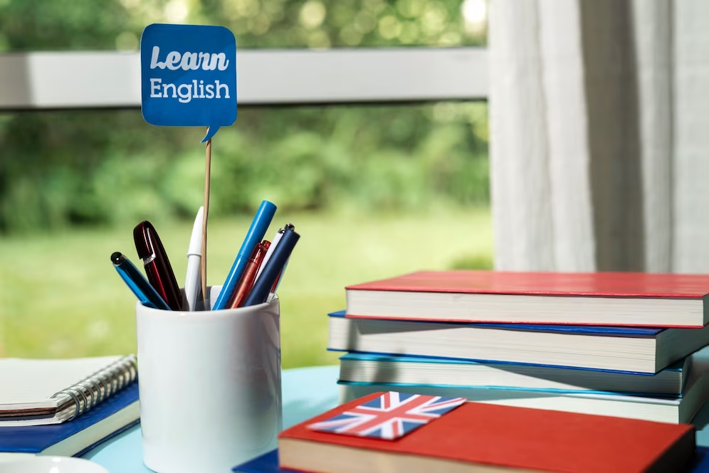 Books and materials for TOEFL exam preparation on a table