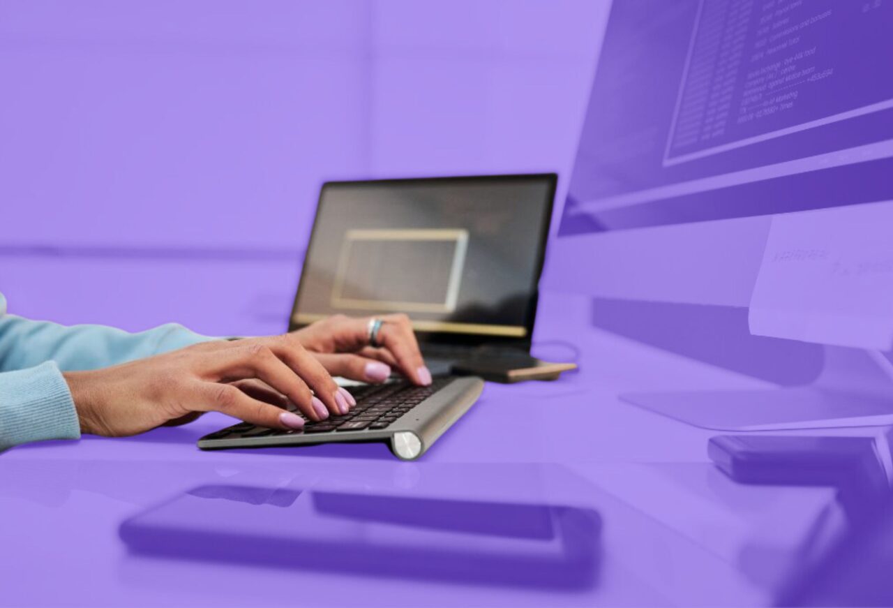 Student typing code on a laptop during a computer science workshop, demonstrating programming and technical skill development for technology careers.