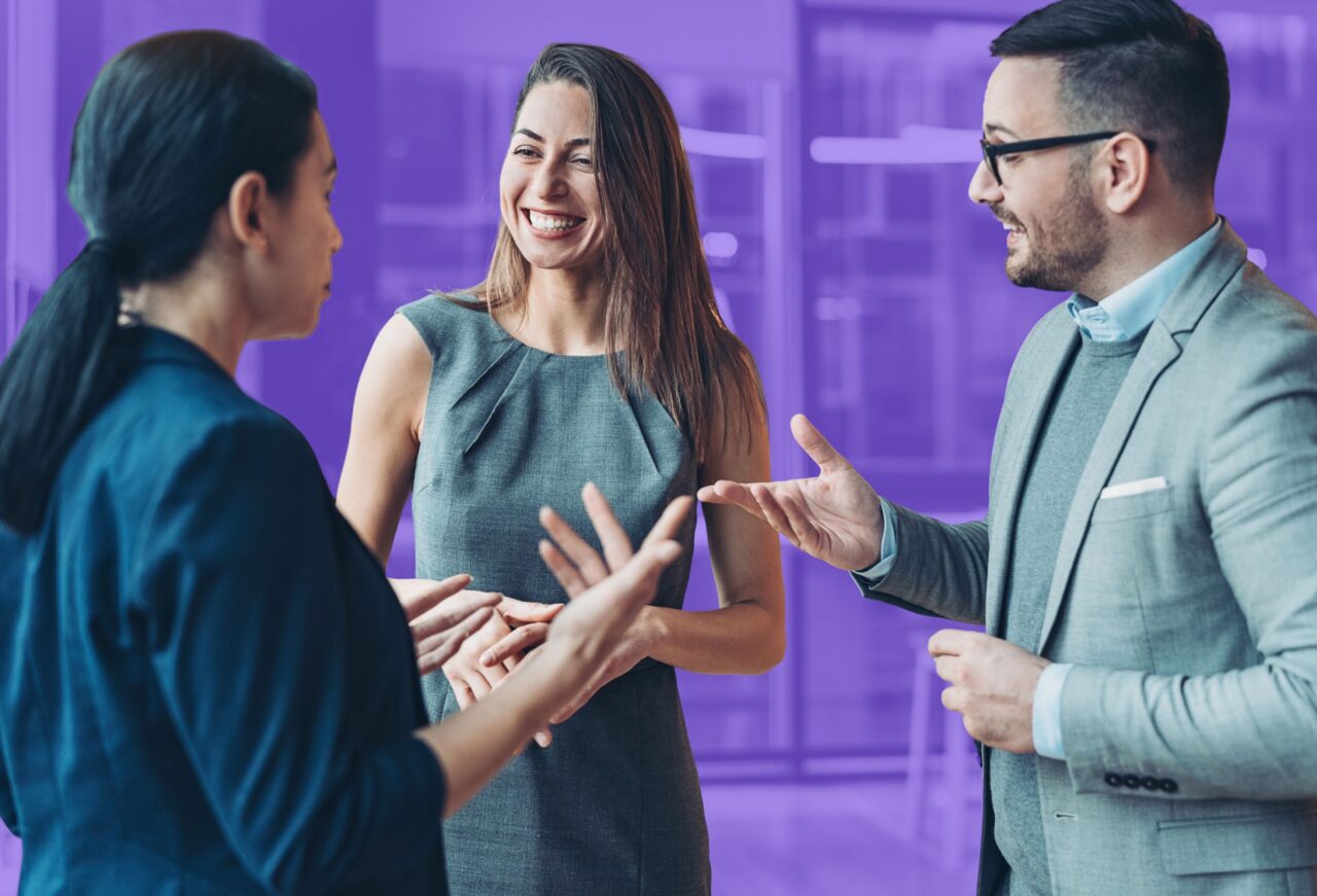 Students speaking with technology professionals during a networking session, learning about careers in computer science, software engineering, and artificial intelligence.